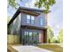 Contemporary two-story home featuring a modern exterior and neatly landscaped front yard at 104 Meldon Ave, Atlanta, GA 30315