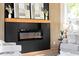 Modern fireplace with floating mantle, set against a bold black accent wall at 104 Meldon Ave, Atlanta, GA 30315