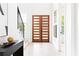 Bright foyer showcasing light wood floors, staircase and modern front doors with glass panels at 104 Meldon Ave, Atlanta, GA 30315