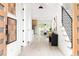 Inviting hallway view featuring light wood floors, modern lighting, and stylish décor at 104 Meldon Ave, Atlanta, GA 30315