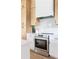 Modern kitchen with stainless steel range, white countertops, and custom cabinets at 104 Meldon Ave, Atlanta, GA 30315