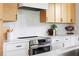 Close up of new stainless steel range and bright countertops with black cabinet pulls at 104 Meldon Ave, Atlanta, GA 30315