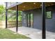 Outdoor patio with a wooden privacy fence and an outdoor patio with black supports, windows, and door at 104 Meldon Ave, Atlanta, GA 30315
