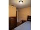 Bedroom featuring a dresser, nightstand, and bed frame in a tan painted room at 3127 Latona Sw Dr, Atlanta, GA 30354