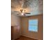 Bedroom featuring a ceiling fan, a window, and a wooden armoire at 3127 Latona Sw Dr, Atlanta, GA 30354