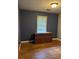 Bedroom featuring a window and a wooden dresser with red floor trim at 3127 Latona Sw Dr, Atlanta, GA 30354