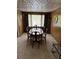 Elegant dining room featuring a spacious table, wood details, and ample seating at 3127 Latona Sw Dr, Atlanta, GA 30354