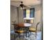 Cozy dining area with round table, chairs, and a ceiling fan for comfortable gatherings at 3127 Latona Sw Dr, Atlanta, GA 30354