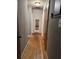 Hallway with hardwood flooring and access to various rooms at 3127 Latona Sw Dr, Atlanta, GA 30354