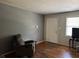 Cozy living room featuring neutral walls, hardwood floors, and natural light at 3127 Latona Sw Dr, Atlanta, GA 30354