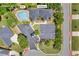 Aerial view showing pool and clubhouse amenities surrounded by lush landscaping at 415 Stephanie Ct, Stockbridge, GA 30281