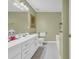 Bathroom featuring white vanity with double sinks and neutral walls at 415 Stephanie Ct, Stockbridge, GA 30281