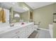 Bathroom featuring white vanity with double sinks and neutral walls at 415 Stephanie Ct, Stockbridge, GA 30281