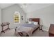 Bright bedroom featuring vaulted ceiling, large window, and neutral walls at 415 Stephanie Ct, Stockbridge, GA 30281