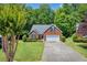 Charming single-story brick home with a well-manicured lawn and attached garage at 415 Stephanie Ct, Stockbridge, GA 30281