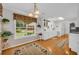 Bright kitchen with white cabinets, long countertops, modern appliances, and window overlooking the back yard at 415 Stephanie Ct, Stockbridge, GA 30281