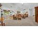 Spacious living room with vaulted ceilings and cozy seating area with dining room beyond at 415 Stephanie Ct, Stockbridge, GA 30281
