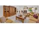 Spacious living room featuring fireplace, built in wood cabinet and lots of comfortable seating at 415 Stephanie Ct, Stockbridge, GA 30281