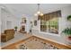 Living room view of the brick fireplace, large window and adjacent sitting area at 415 Stephanie Ct, Stockbridge, GA 30281