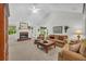 Spacious living room featuring fireplace, built in wood cabinet and lots of comfortable seating at 415 Stephanie Ct, Stockbridge, GA 30281