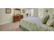 Relaxing bedroom featuring soft carpet, neutral walls, and classic wooden furniture at 415 Stephanie Ct, Stockbridge, GA 30281