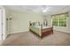 Large bedroom with natural light, neutral walls, and fan at 415 Stephanie Ct, Stockbridge, GA 30281