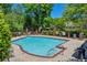 Community pool featuring a spacious deck with ample seating and mature landscaping at 415 Stephanie Ct, Stockbridge, GA 30281