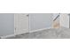 View of basement with gray carpet and white door at 740 Marcus Nyah Ct, Atlanta, GA 30349