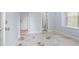 Bedroom with unique stained concrete floors and natural light at 740 Marcus Nyah Ct, Atlanta, GA 30349