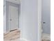 Hallway with a unique stained concrete floor, a white door, and white trim at 740 Marcus Nyah Ct, Atlanta, GA 30349