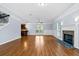 Spacious living room with hardwood floors, recessed lighting, and an inviting fireplace at 740 Marcus Nyah Ct, Atlanta, GA 30349