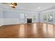 Bright living room features ample natural light, hardwood flooring, and a ceiling fan at 740 Marcus Nyah Ct, Atlanta, GA 30349