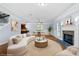 Bright living room with a cozy fireplace and stylish decor for comfortable living at 740 Marcus Nyah Ct, Atlanta, GA 30349