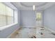 Room with a window, unique stained concrete floors, and a door at 740 Marcus Nyah Ct, Atlanta, GA 30349