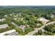Overhead view of the property with retail and lush trees, highlighting its prime location at 10090 Jones Bridge Rd # 2, Alpharetta, GA 30022