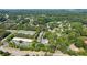 Aerial view showcasing nearby parking, roads, retail, and surrounding lush trees at 10090 Jones Bridge Rd # 2, Alpharetta, GA 30022
