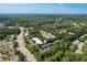 Aerial view of property with greenery, roads, parking, and nearby shopping at 10090 Jones Bridge Rd # 2, Alpharetta, GA 30022