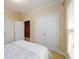 Comfortable bedroom featuring natural light, a closet, and neutral tones at 10090 Jones Bridge Rd # 2, Alpharetta, GA 30022