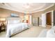 Beautiful bedroom with tray ceilings, natural light and access to en suite bathroom and walk-in closets at 10090 Jones Bridge Rd # 2, Alpharetta, GA 30022