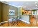 Cozy breakfast nook with a glass table adjacent to kitchen at 10090 Jones Bridge Rd # 2, Alpharetta, GA 30022