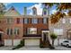 Charming brick townhome with a two-car garage and a well-manicured front yard at 10090 Jones Bridge Rd # 2, Alpharetta, GA 30022