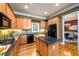 Spacious kitchen featuring dark countertops, a black refrigerator, and a kitchen island at 10090 Jones Bridge Rd # 2, Alpharetta, GA 30022