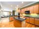 This kitchen includes a kitchen island and stainless steel appliances at 10090 Jones Bridge Rd # 2, Alpharetta, GA 30022