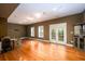 Bright, expansive living room with hardwood floors and natural light at 10090 Jones Bridge Rd # 2, Alpharetta, GA 30022