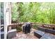 Outdoor patio with wicker seating and grill at 10090 Jones Bridge Rd # 2, Alpharetta, GA 30022