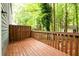 Inviting deck area overlooking a private backyard with mature trees at 3001 Majestic Park Ct, Duluth, GA 30096