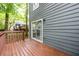 Wooden deck attached to house with siding, overlooking a wooded backyard at 3001 Majestic Park Ct, Duluth, GA 30096