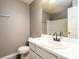 Bathroom with a white single sink vanity, a neutral wall, and a shower at 3001 Majestic Park Ct, Duluth, GA 30096