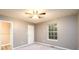 Neutral bedroom with natural light from the window and a ceiling fan at 3001 Majestic Park Ct, Duluth, GA 30096