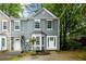 Charming two-story townhome with gray siding, white trim, and a neatly landscaped front yard at 3001 Majestic Park Ct, Duluth, GA 30096